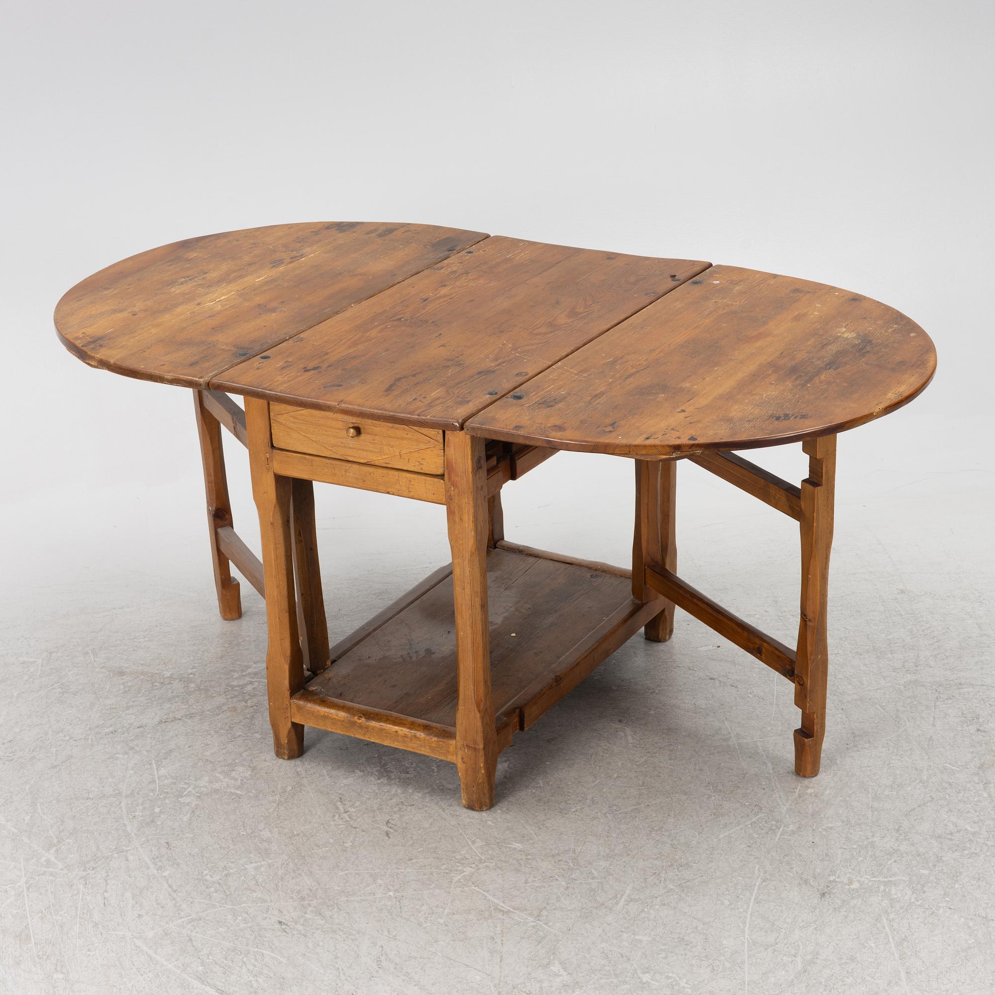 An 19th century drop-leaf table.