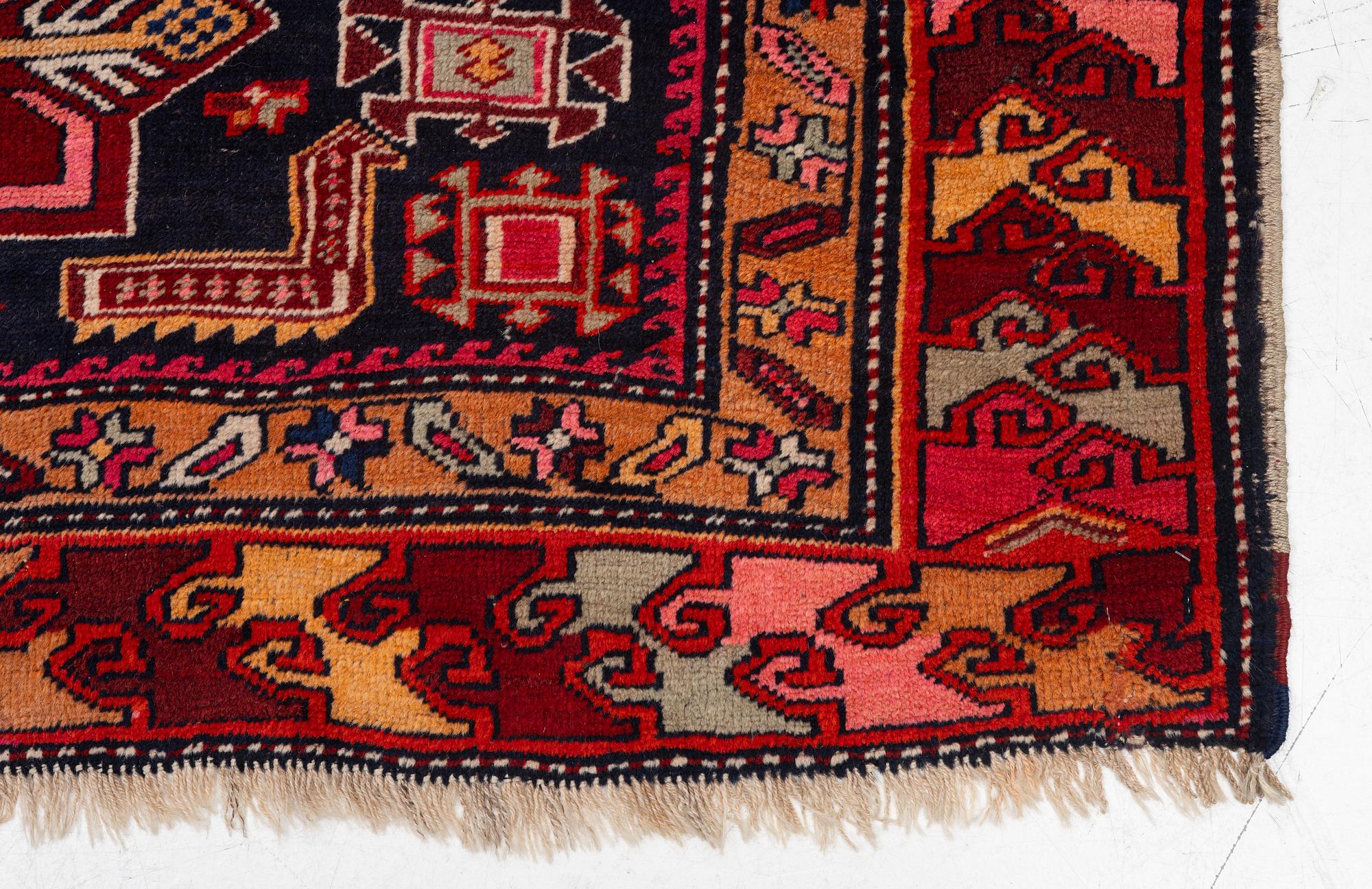 A semi-antique Anatolian runner, c. 409 x 159 cm.