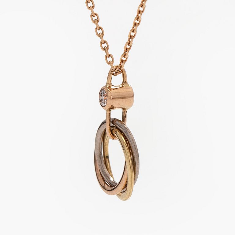 Cartier, an 18K gold 'Trinity Pendant' necklace with a brilliant-cut diamond.