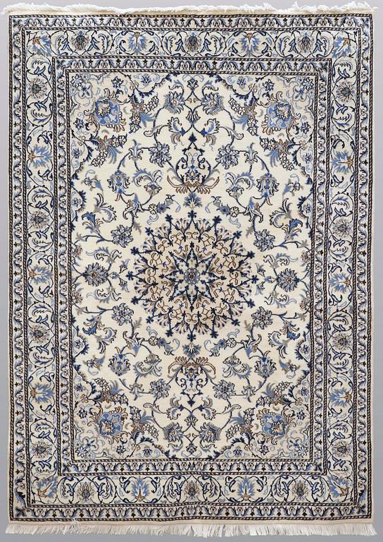 A rug, Nain part silk, ca 235 x 160 cm.