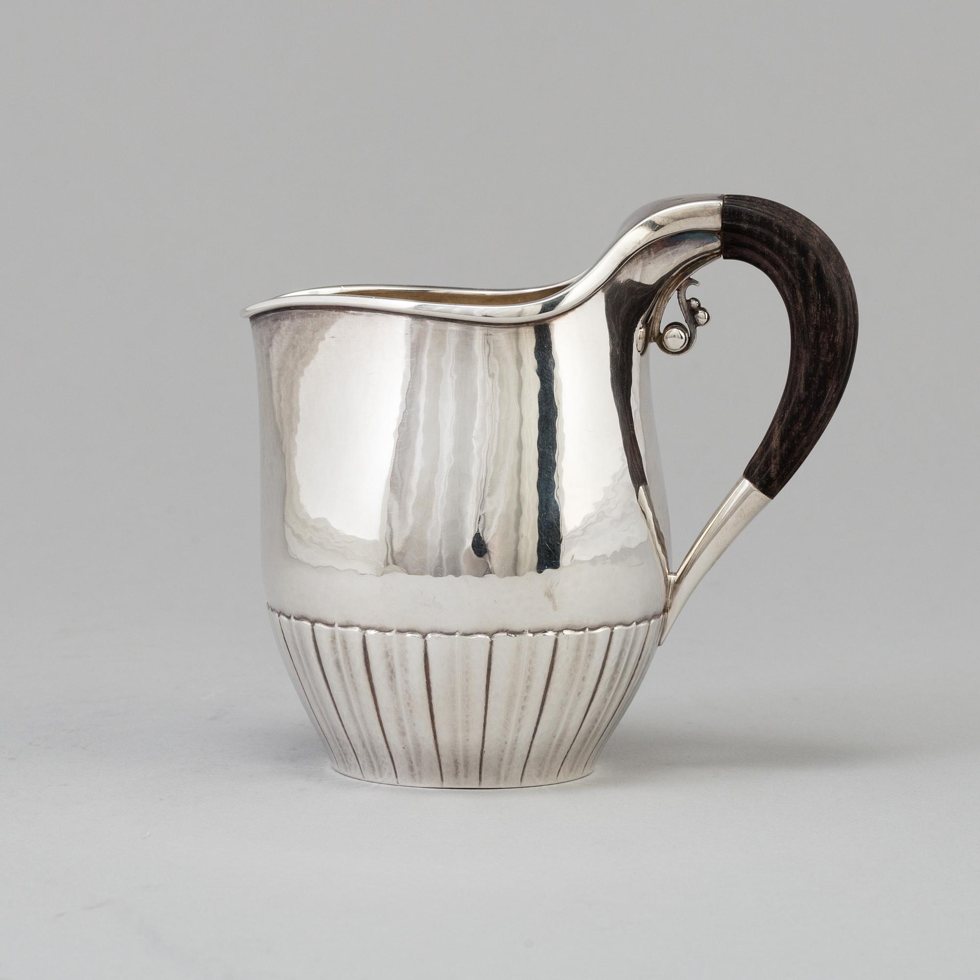 A"Cosmos", cream jug, sterling silver. Designed by Johan Rodhe for Georg Jensen, modell no 45E, weight 175 grams.