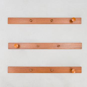 A set of three No. 140 wall coat hangers with manufacturer's mark.