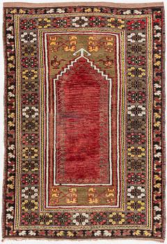 A prayer rug, approx. 140 x 98 cm.