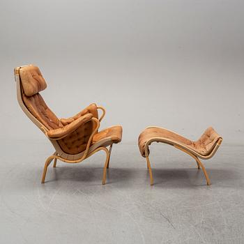 Bruno Mathsson, a "Pernilla" lounge chair with ottoman, DUX, Sweden, late 1900's.