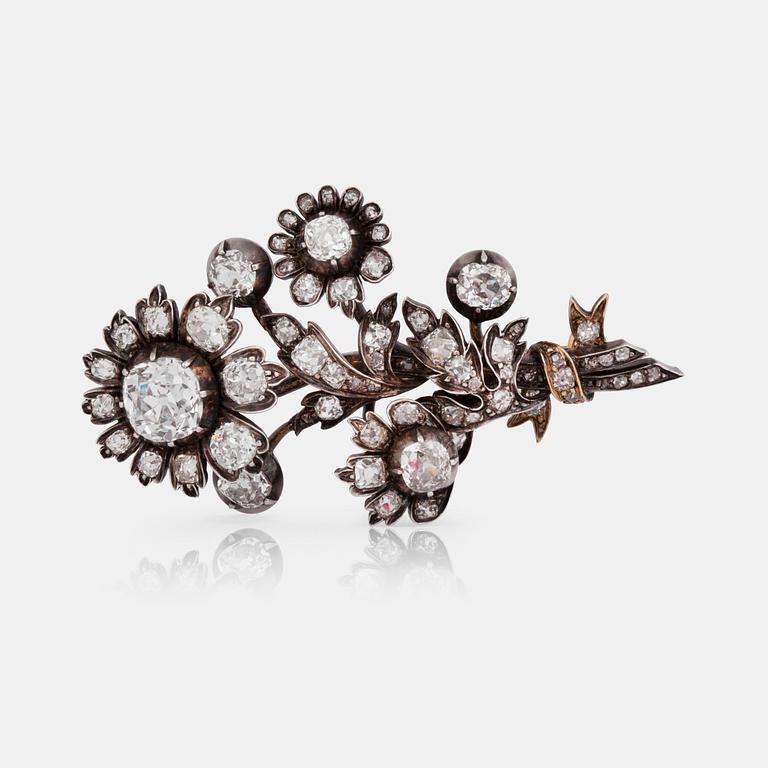 A Victorian antique-cut diamond brooch in the shape of a bouquet of flowers.