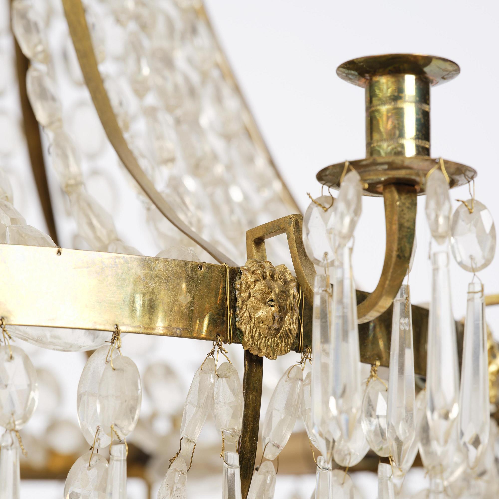 A Swedish gilt brass and cut glass thirteen-light Empire chandelier, early 19th century.