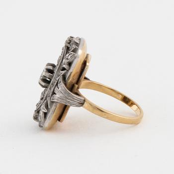 A facet cut diamond ring.