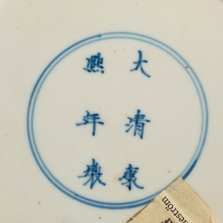 A set of four blue and white dinner plates, Qing dynasty, with Kangxi six character mark and period (1662-1722).