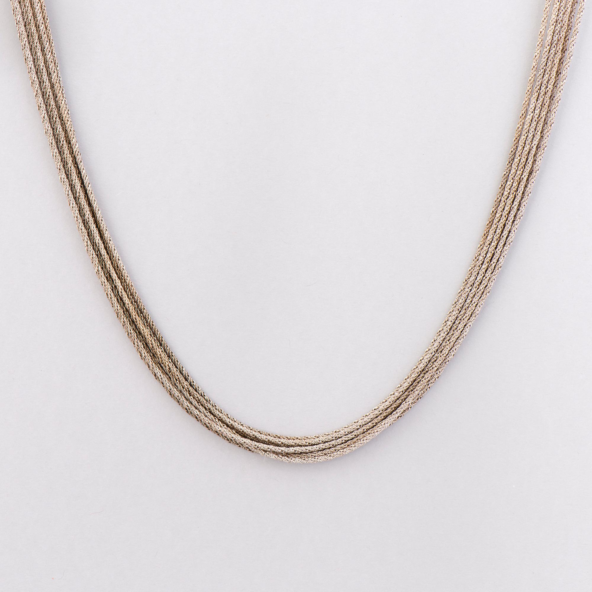 KAULAKORU, 18K valkokultaa. A. Tillander, Helsinki 1973.