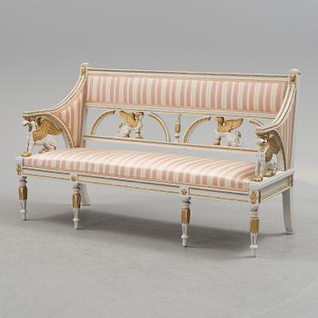 A set of two armchairs, a sofa, a stool and a chair. Early 20th century.