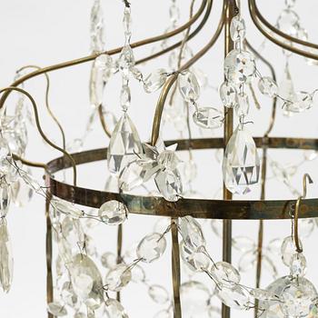 A three-light Gustavian-style hanging light, circa 1900.