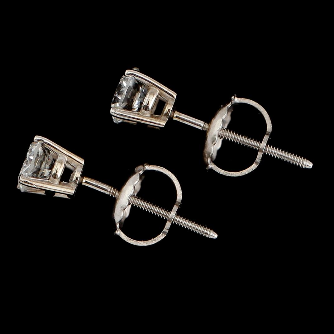 ÖRHÄNGEN, 1 par, 14  guld, solitära briljantslipade diamanter tot ca 0.40 ct.