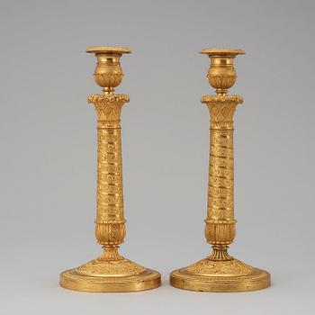 A pair of French Empire early 19th century candlesticks.