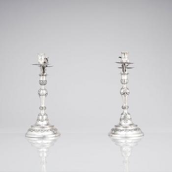 A pair of Swedish 18 century silver candelabras, mark of Lars Åkerblom Gävle 1775, arms by Christian Kullberg.