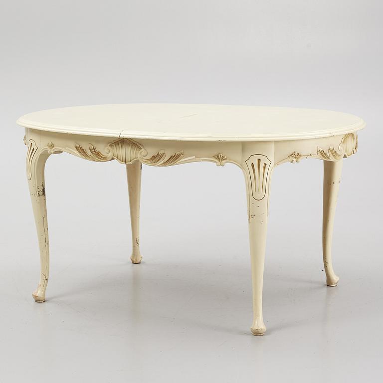 A Rococo style Dining Table with Chairs, first half of the 20th Century.