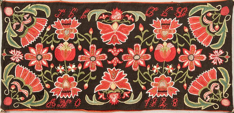Carriage cushion (agedyna) from Skåne, dated 1828, embroidered, approximately 103x49 cm.
