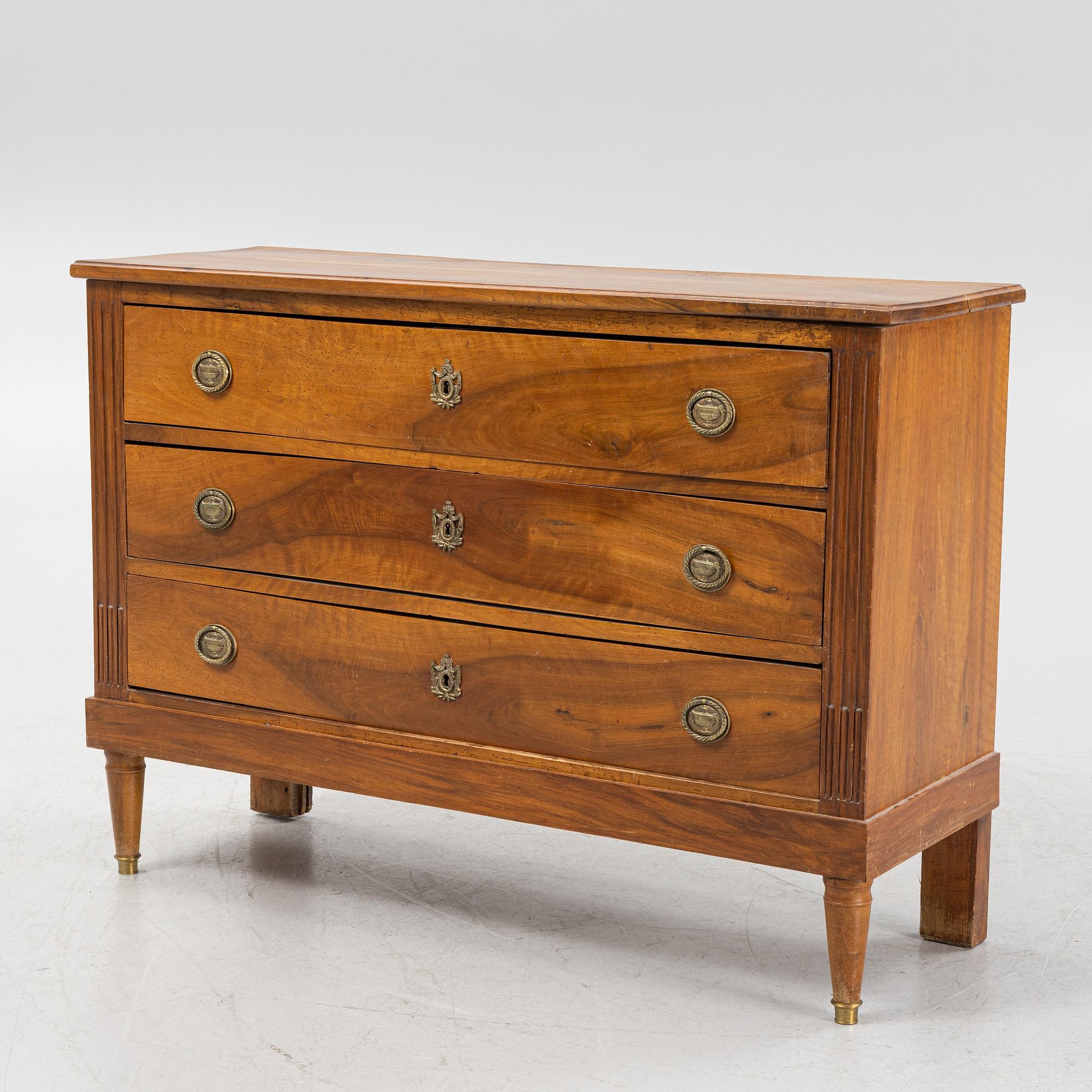 A Walnut veneered chest of drawers, late 19th Century.