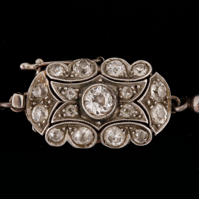 A cultivated saltwater pearl necklace. Circa 3.3-7.5 mm. Clasp with old cut diamonds, total gem weight circa 0.75 ct.