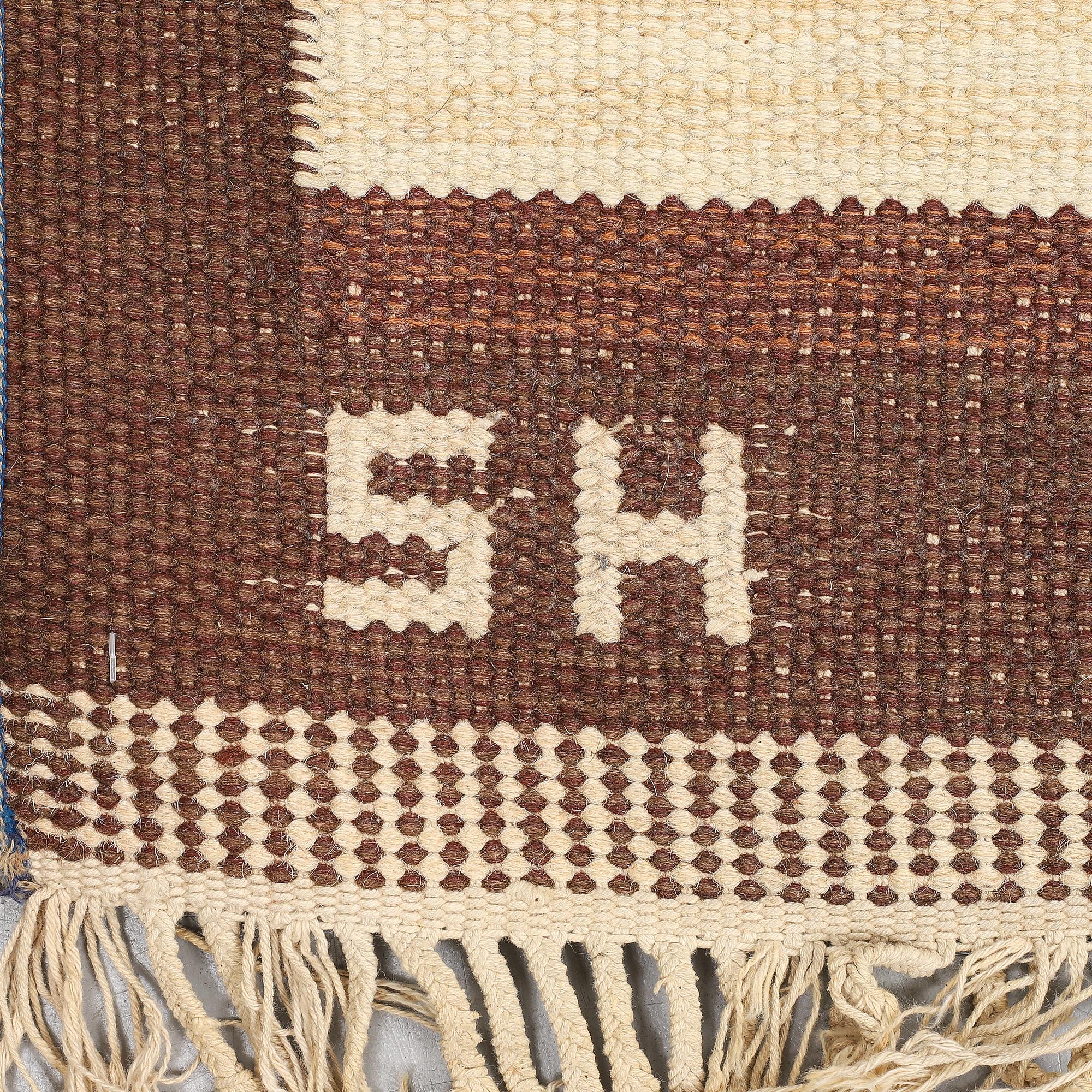 A carpet, flat weave, ca 291 x 202 cm, signed SH.