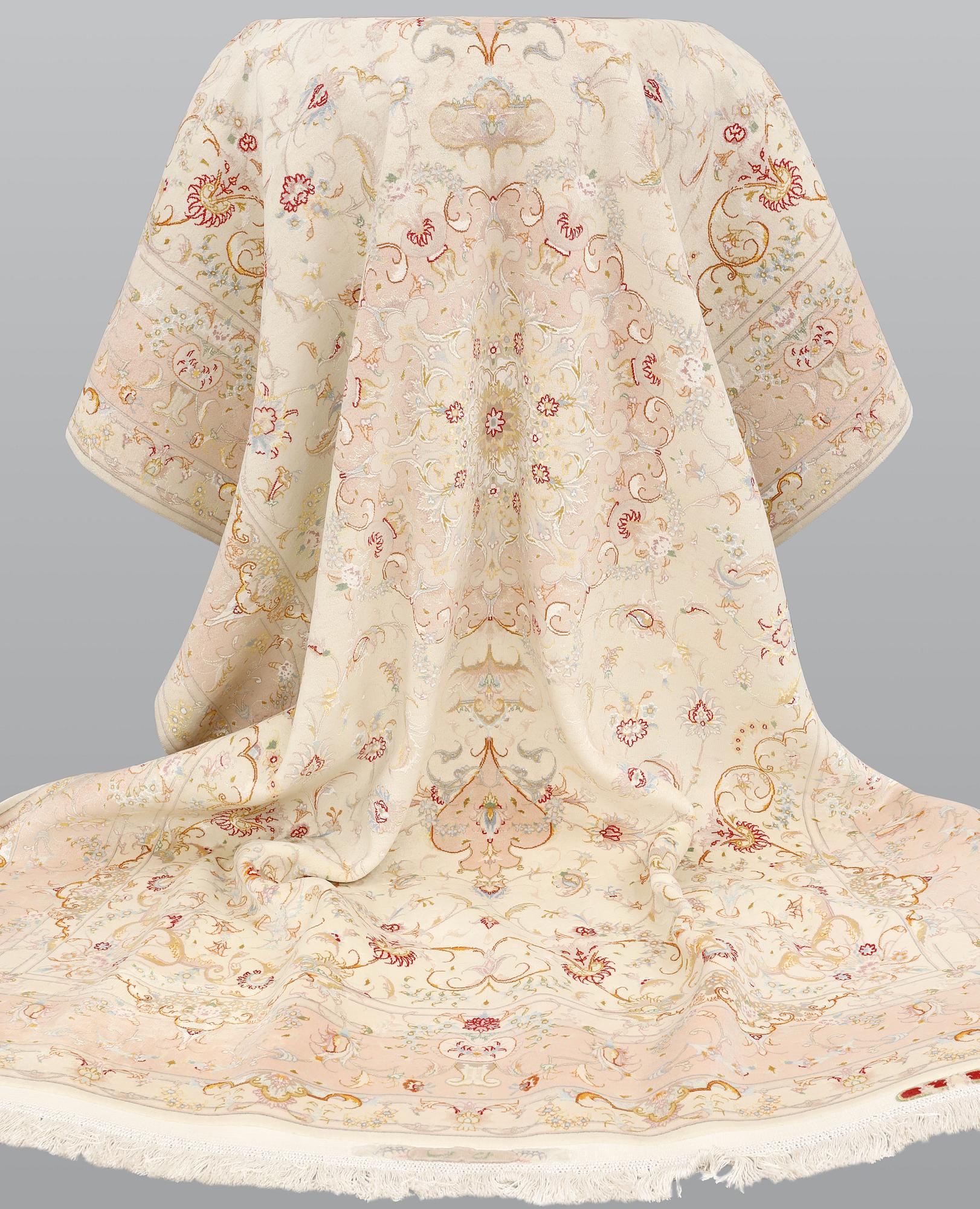 A Tabriz part silk carpet, signed, 305 x 203 cm.