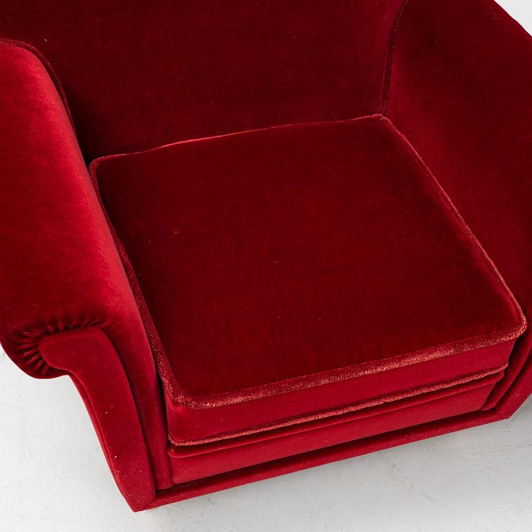 A pair of velvet upholstered easy chairs, mid 20th Century.