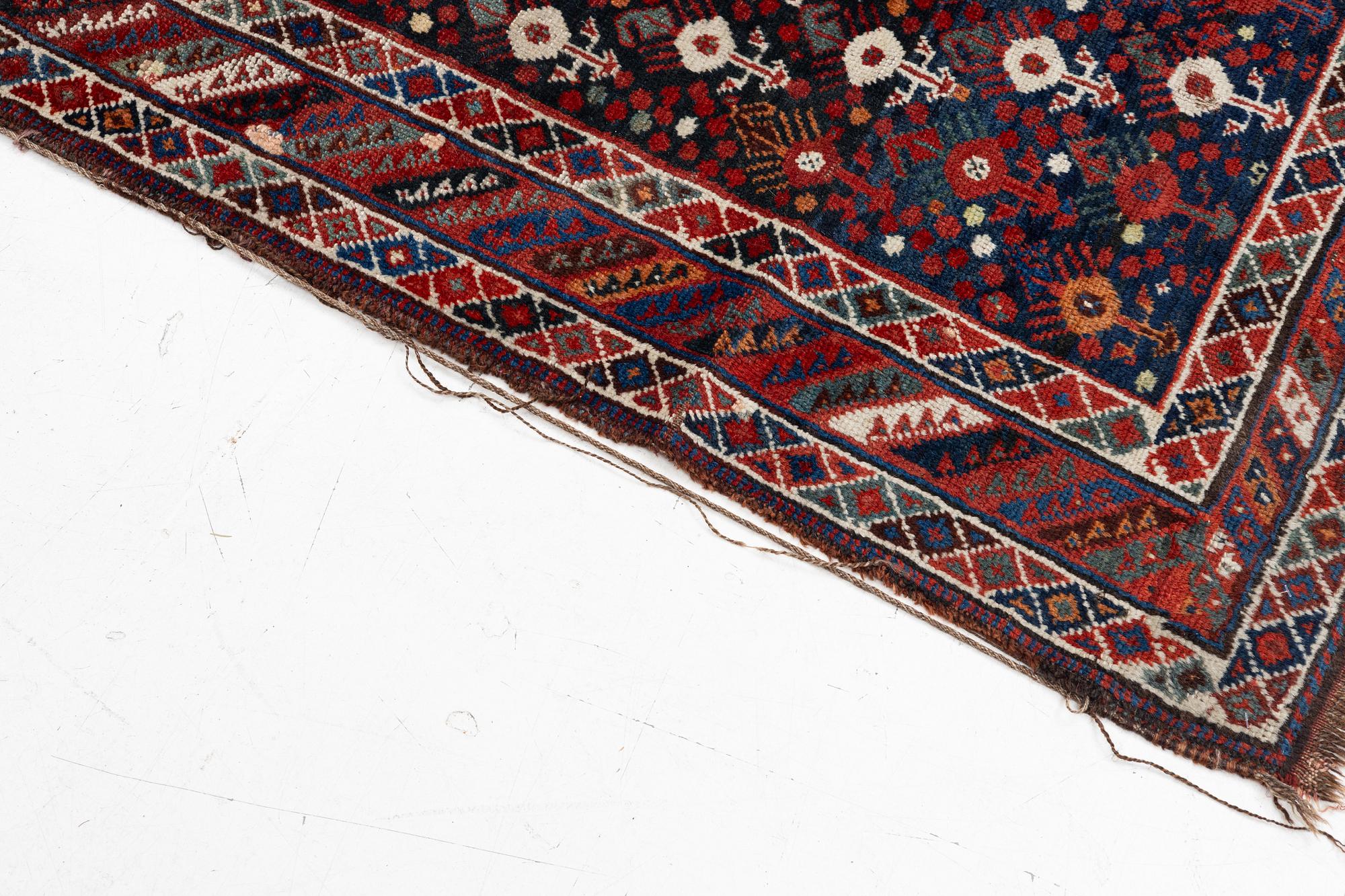 An antique Qashgai rug, 230 x 135 cm.
