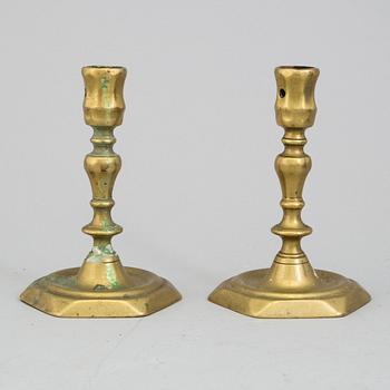 A PAIR OF BRONZE CANDLESTICKS, 18th century.