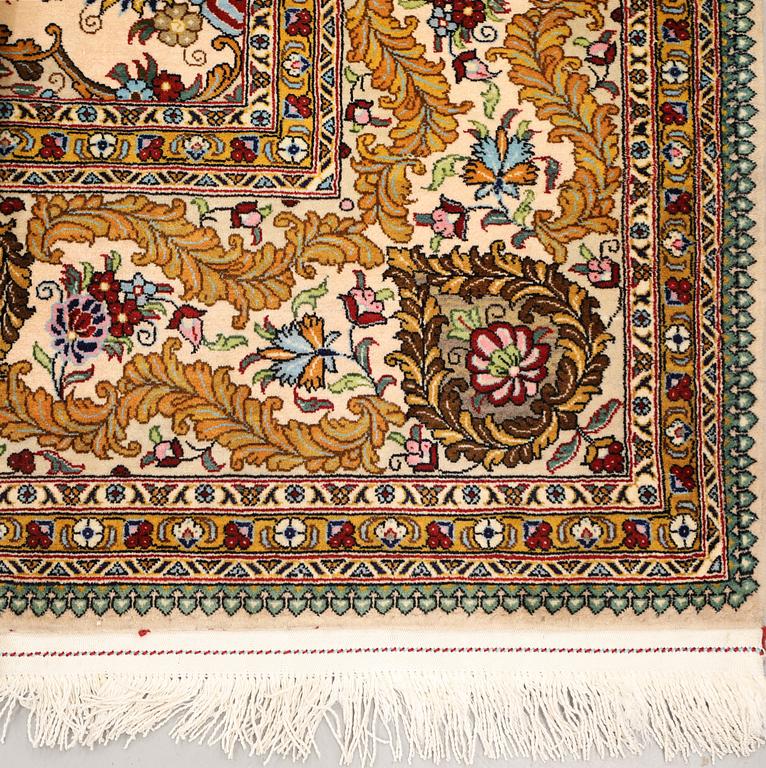 A part silk Ghom carpet, c. 420 x 310 cm.