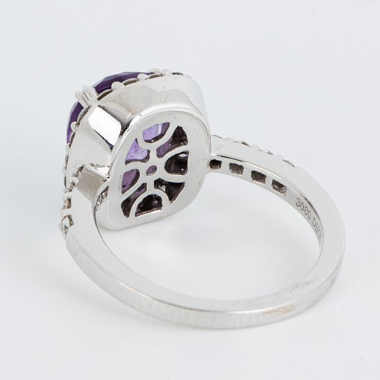 Brilliant-cut diamond and checker-cut amethyst ring.