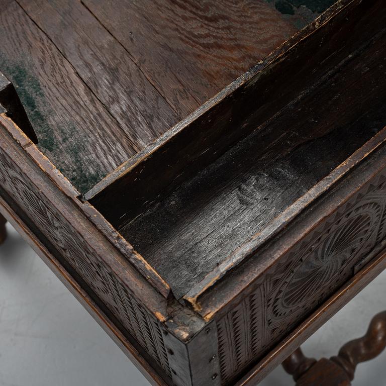 A late 18th or early 19th century wooden box on a stand from early 20th century.