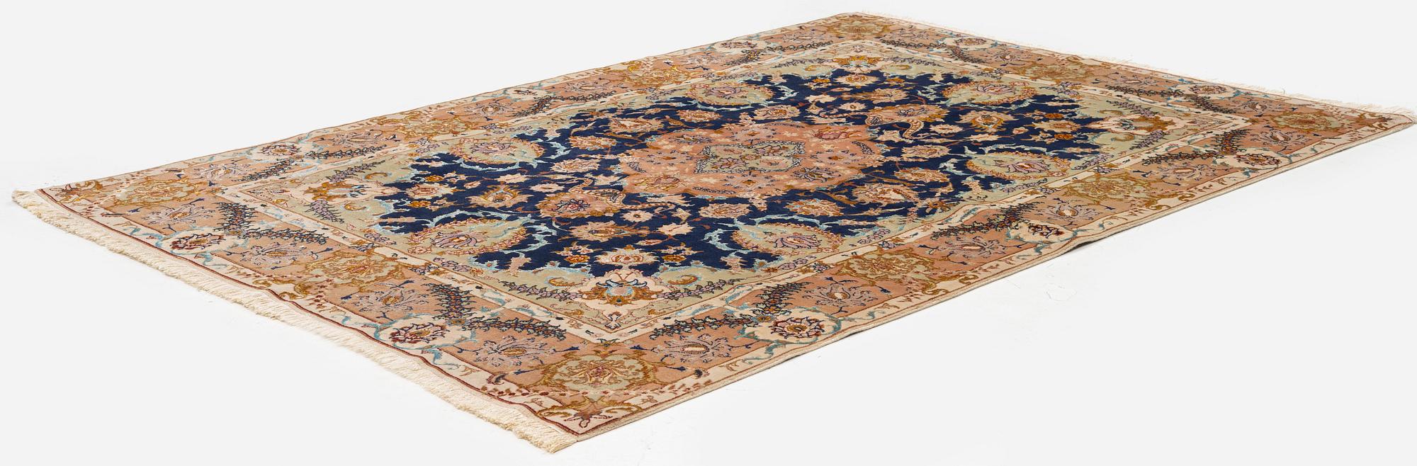 A Tabriz carpet, part silk, c. 206 x 147 cm.