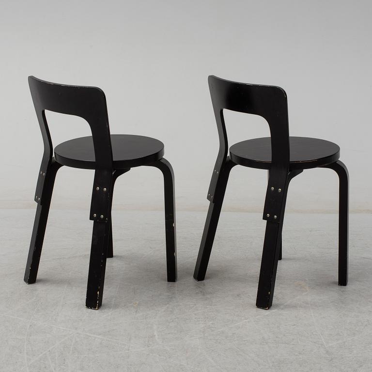 ALVAR AALTO, a pair of painted model 65 chairs from Artek, Finland.