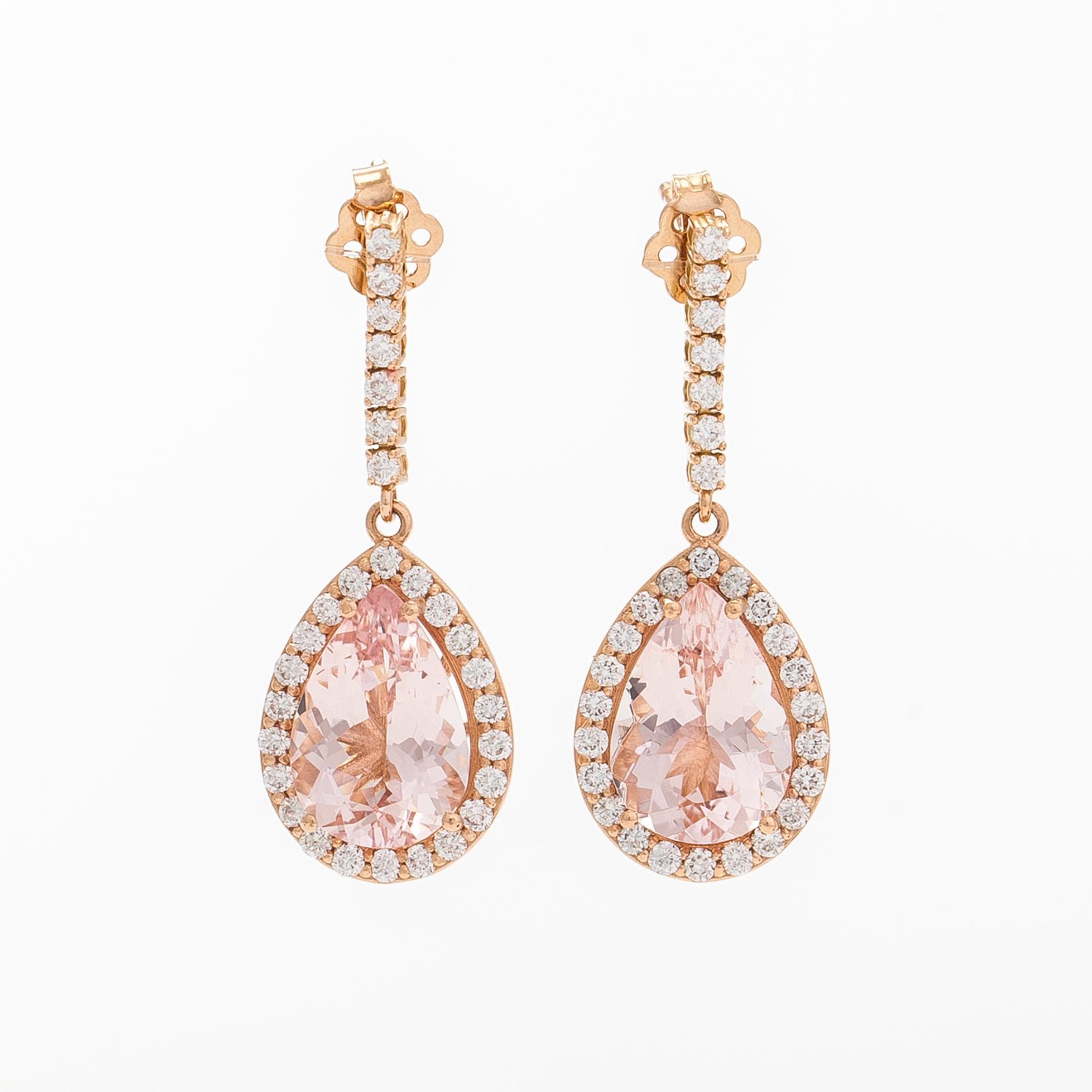 A pair of 18K gold earrings, with pear-cut morganites and diamonds.