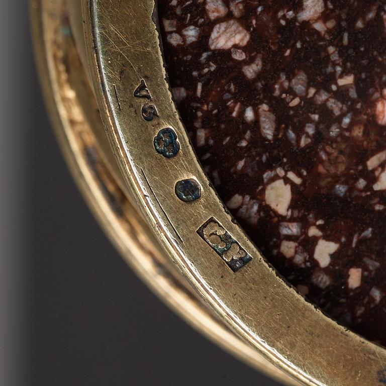 A pair of gilt silver and porphyry salts, by Gustaf Folcker, Stockholm 1827.