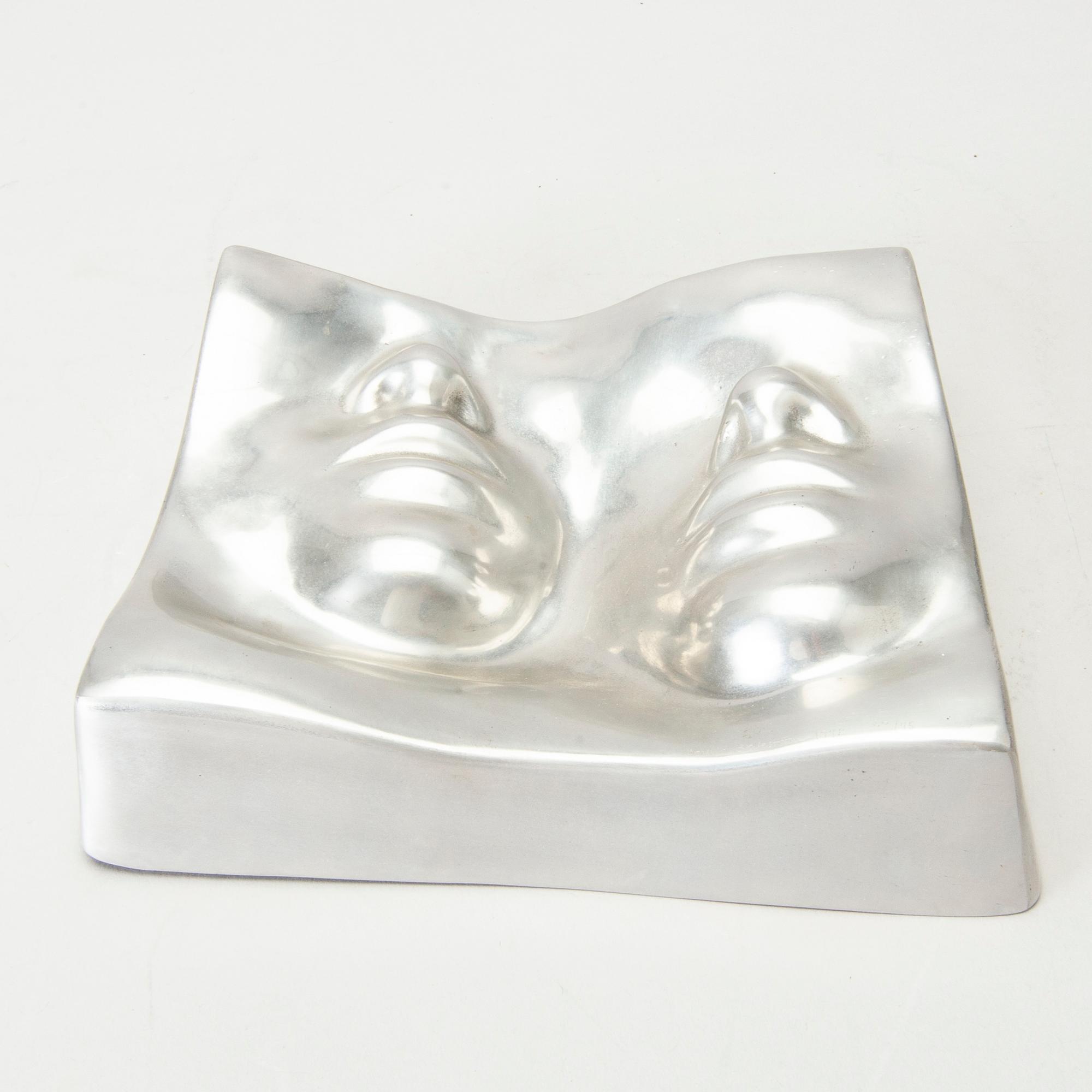 An Barbro Bäckström relief in aluminium. Signed and dated 60/75 1972.