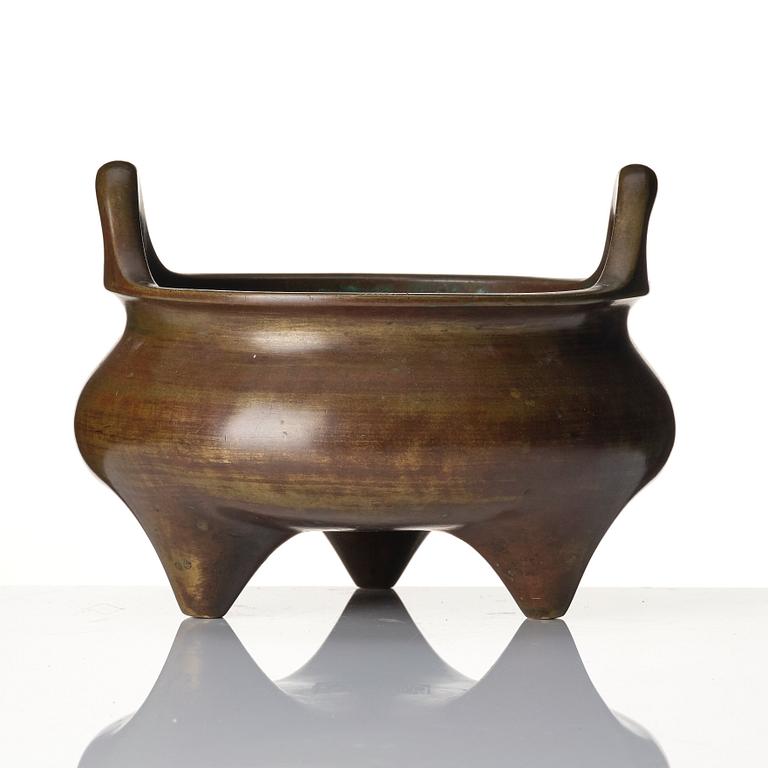 A large bronze tripod censer, Qing dynasty with Xuande six character mark.