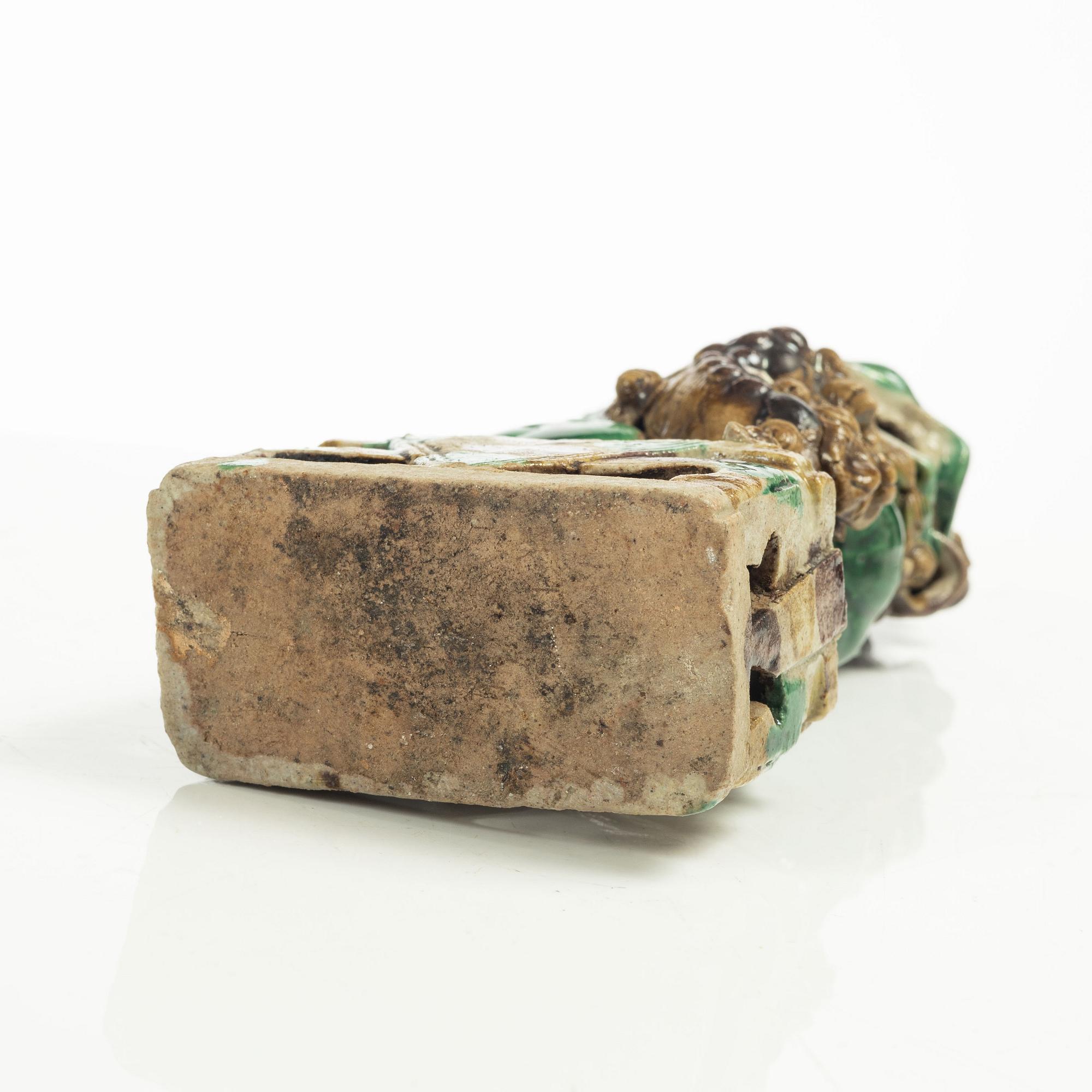 A Sancai glazed Buddhist lion incense/joss stick holder, Qing dynasty, Kangxi (1662-1722).