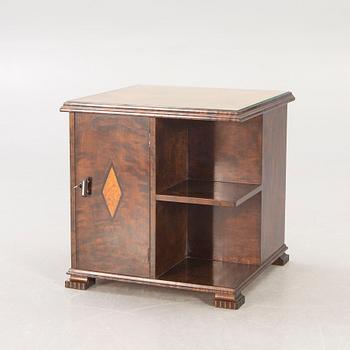 A 1930s birch side table.