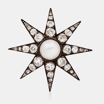 578. A late Victorian old cut diamond and probably natural pearl brooch in the shape of a star.