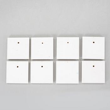 nine wall plaques, signed.