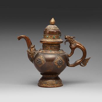 114. An copper alloy teapot with silver inlays, Tibet 19th Century.