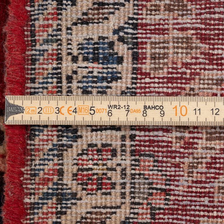 An Persian carpet, ca. 310 x 215 cm.