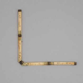 A 19TH CENTURY BONE FOLDING RULER.