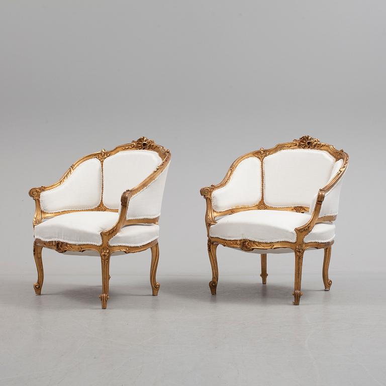 A pair of 20th century easy chairs.