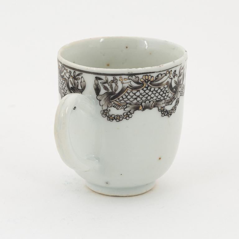 A Chinese grisaille cup and two saucers, porcelain, Qing dynasty, Qianlong (1736-95).