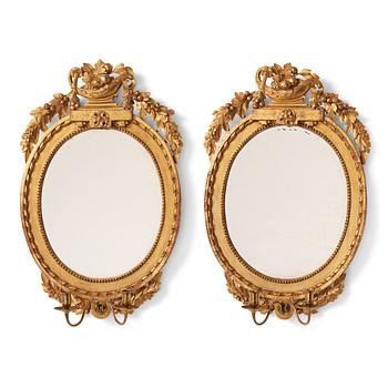 100. A pair of Gustavian late 18th century two-light girandole mirrors.