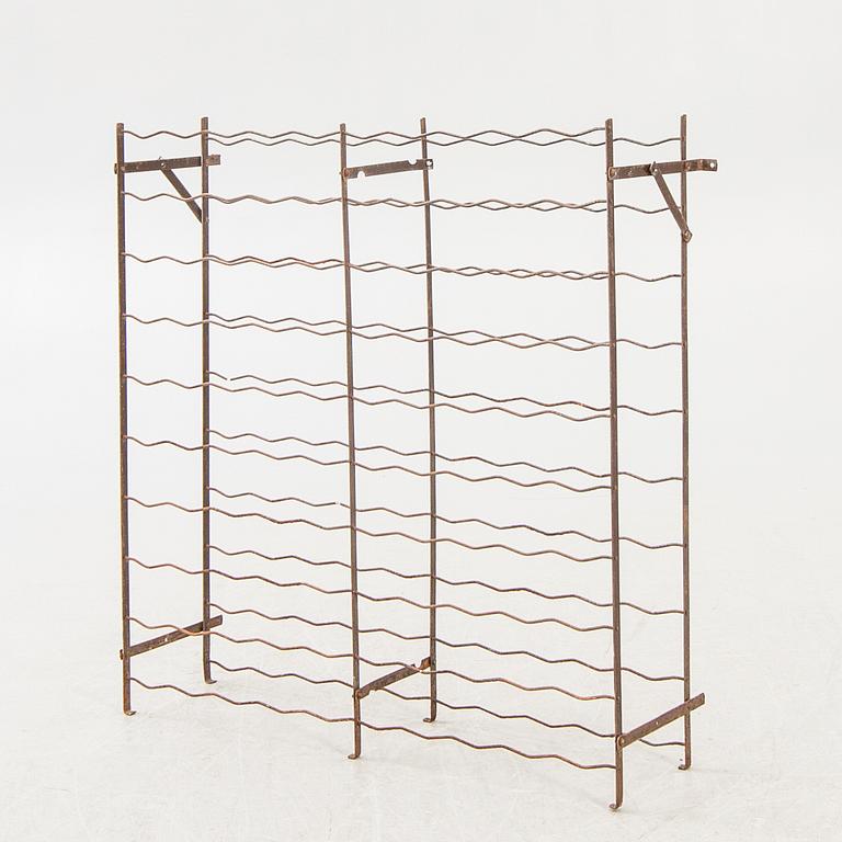 A 20th century metal wine rack.