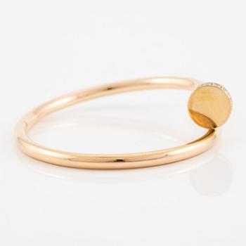 A Cartier bracelet "Juste un clou" in 18K rose gold with round brilliant-cut diamonds.