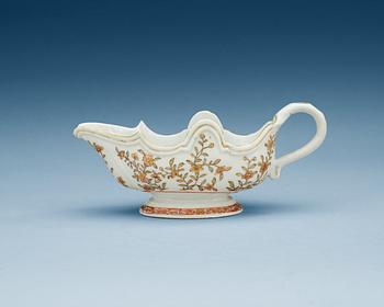 1458. A rouge de fer and gold sauce boat, Qing dynasty, Qianlong (1736-95).