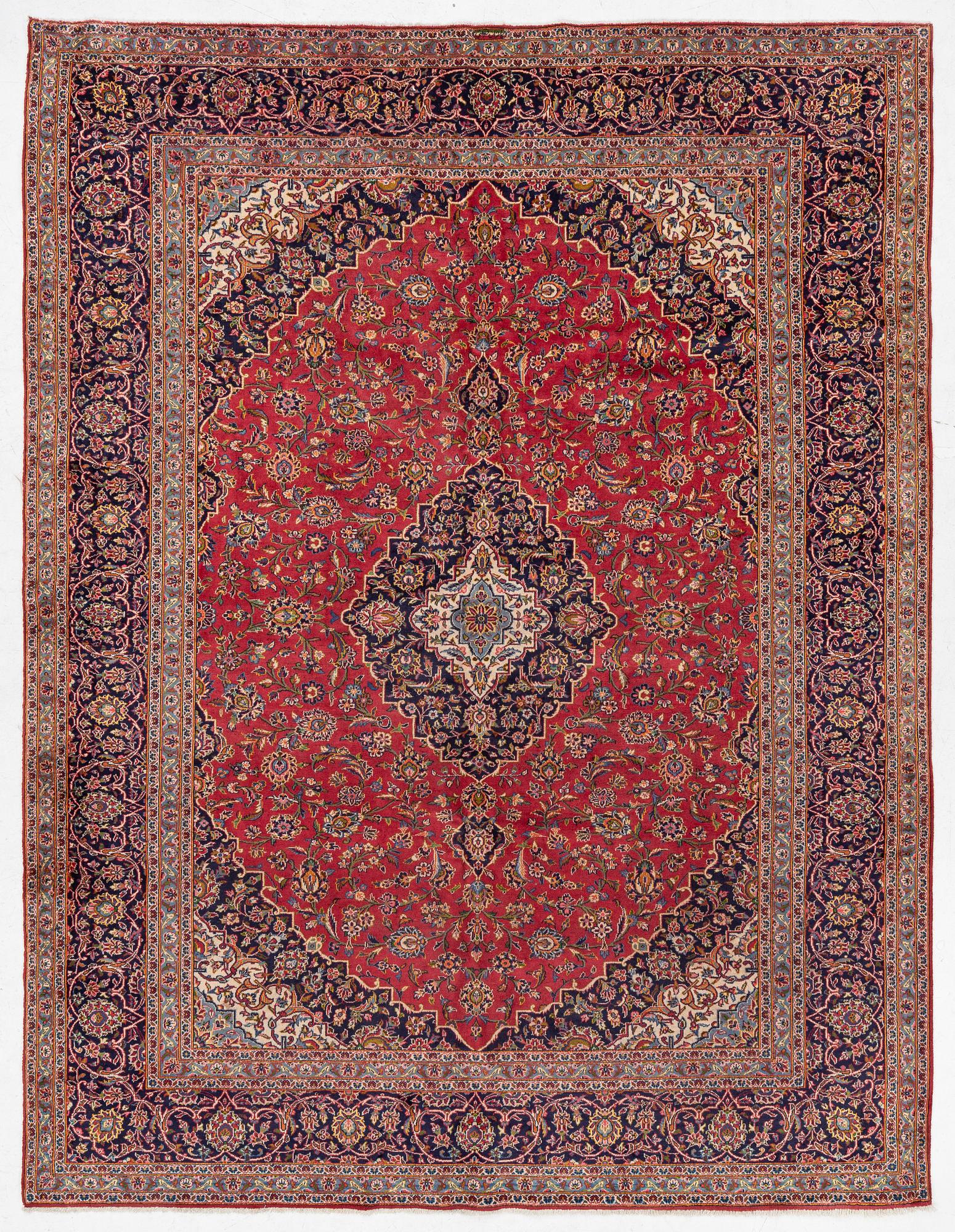 A Keshan carpet, central Iran, signed c, 392 x 301 cm.